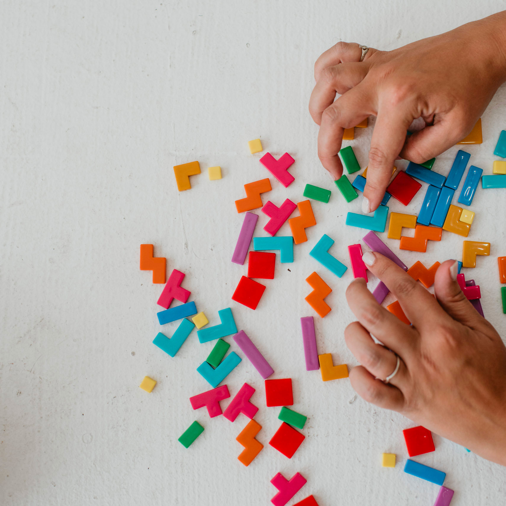 Hands doing a puzzle