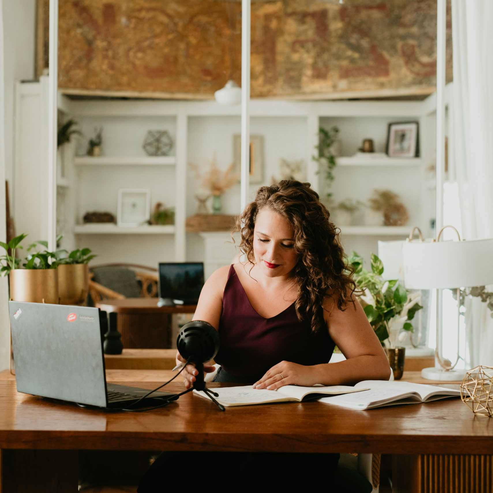 Kaitlin working at a desk