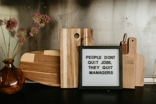Letter board that says people don't quit jobs, they quit managers
